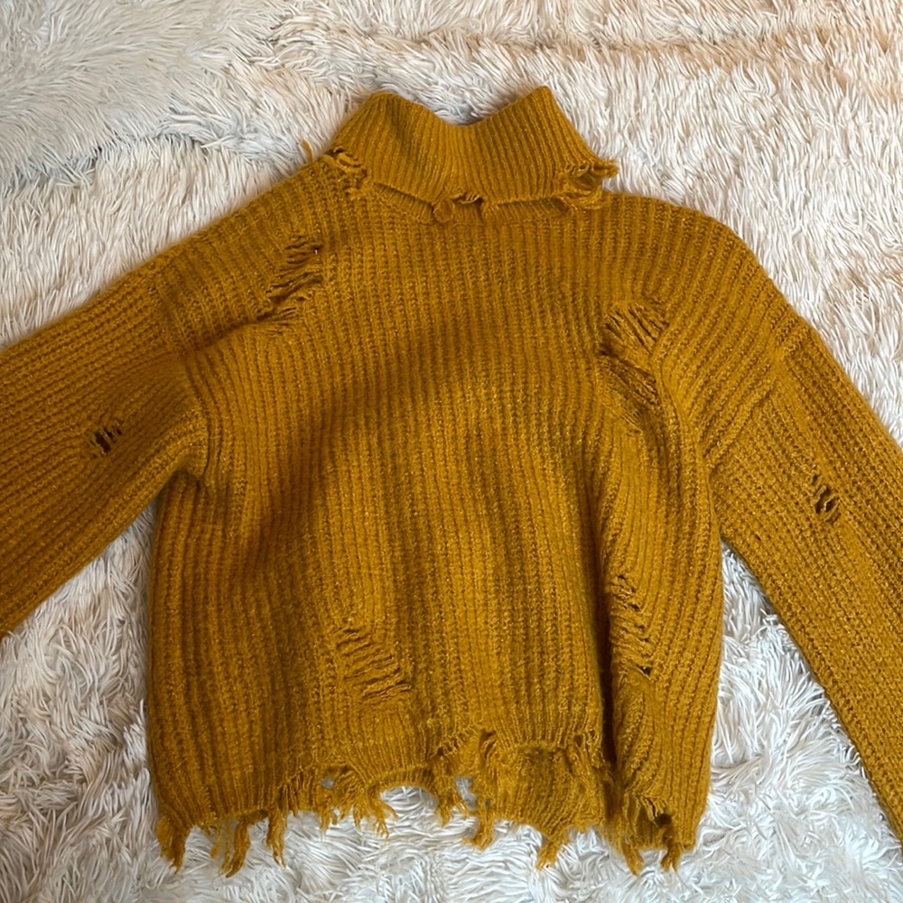 Distressed turtleneck